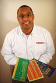 African American man with glasses holding tcs products